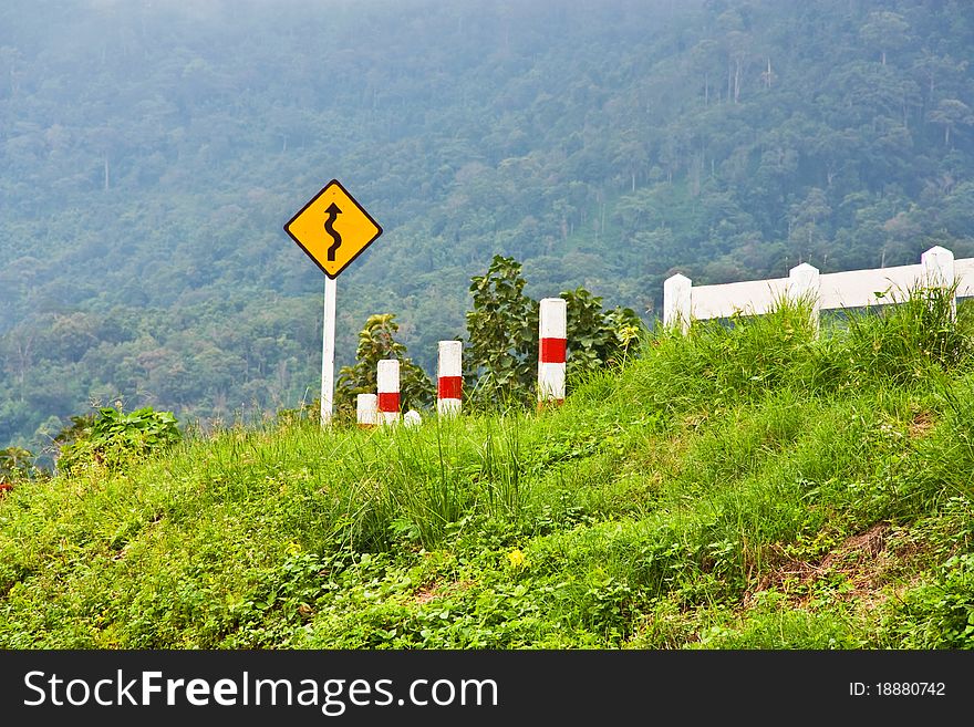 Curve sign for road on mountain