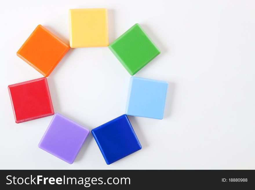 7 rainbow colored and blank squares with shadows on bright background. There is a place for text on the right side and in the middle of the circle. 7 rainbow colored and blank squares with shadows on bright background. There is a place for text on the right side and in the middle of the circle
