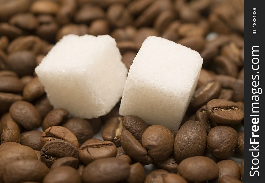 Sugar on a coffee beans closeup