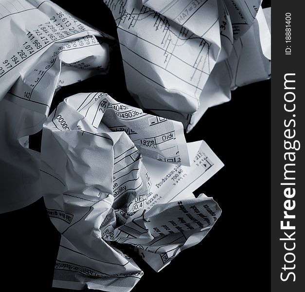 Crumpled financial papers on black background. Crumpled financial papers on black background