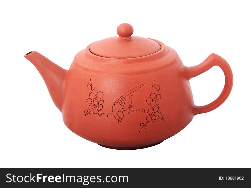 Lay red teapot with a lid and drawing on the isolated white background. Lay red teapot with a lid and drawing on the isolated white background