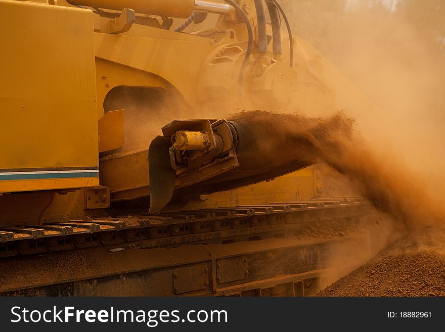 Yellow Trencher Machine Working