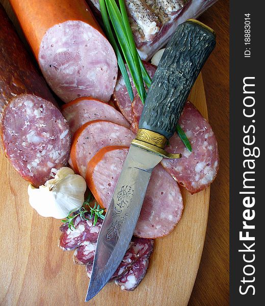 Sausages on a wooden cutting board