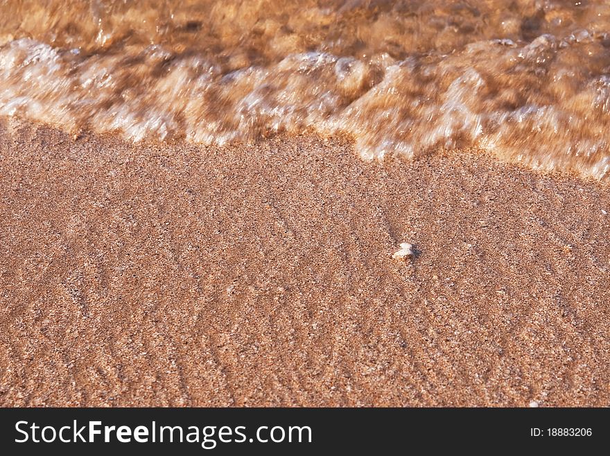 Wave On Beach Sand