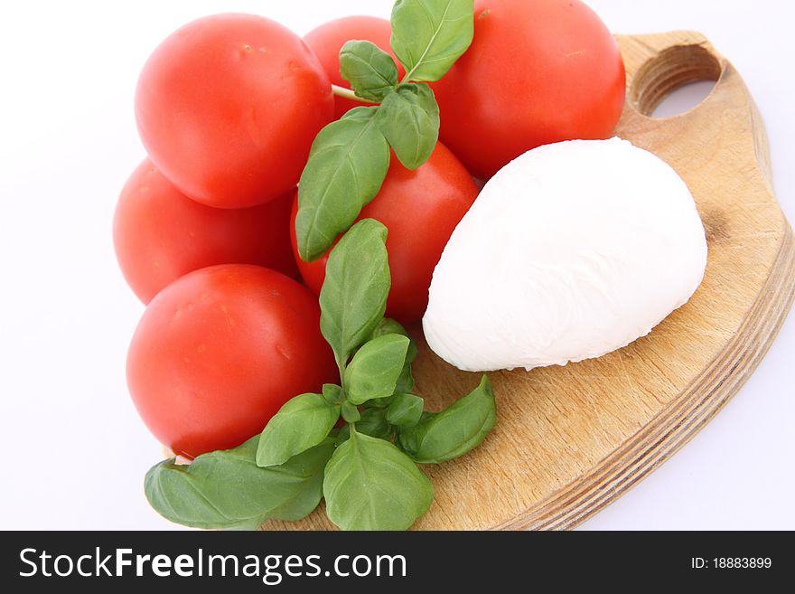 Caprese salad ingredients- tomatoes, mozzarella cheese and basil