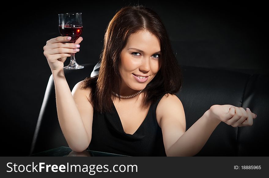 Pretty young women with glass of red wine. Pretty young women with glass of red wine
