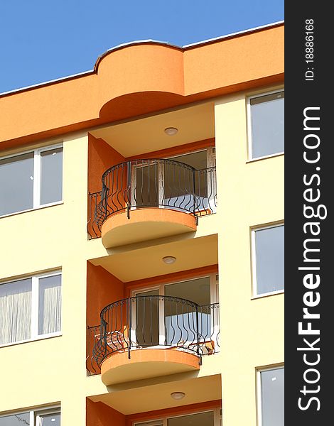 Terraces of residential building on a background blue sky