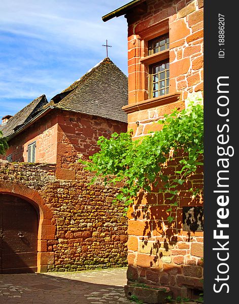 On the photo: Details of old traditional French house. Collonges La Rouge
