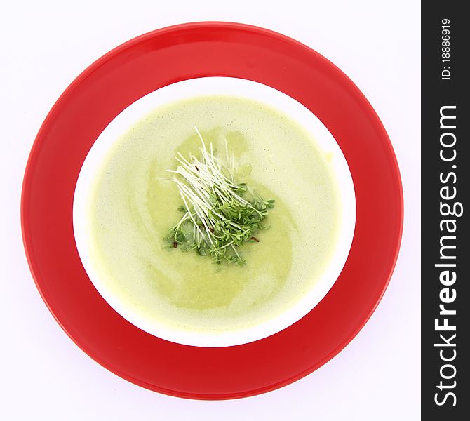 Pea and mozzarella soup decorated with some cress