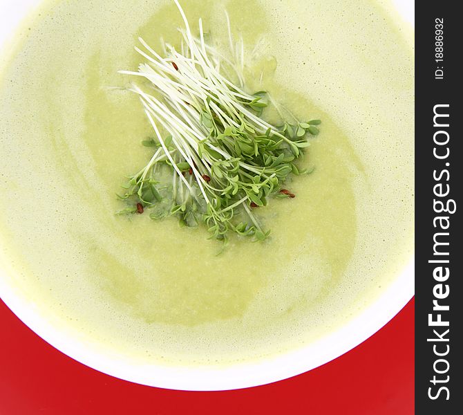 Pea and mozzarella soup decorated with some cress. Pea and mozzarella soup decorated with some cress