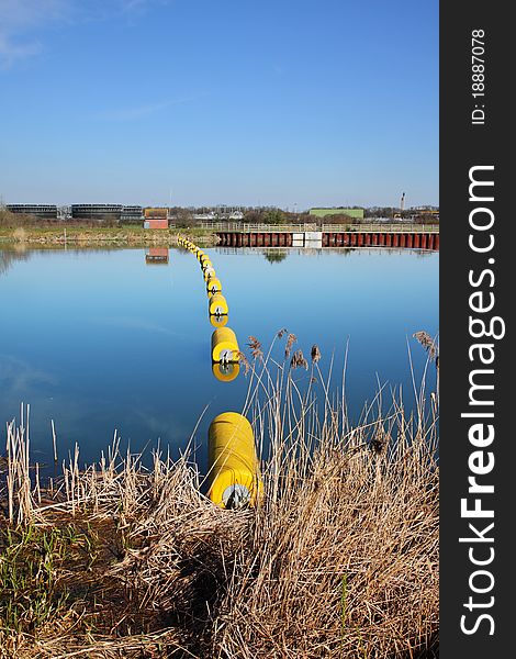 Floating cylindrical Barriers Barrier on the Thames flood relief River in England. Floating cylindrical Barriers Barrier on the Thames flood relief River in England