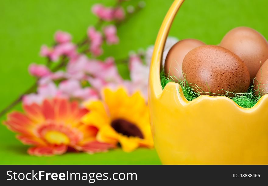 Basket full of Easter eggs and flower