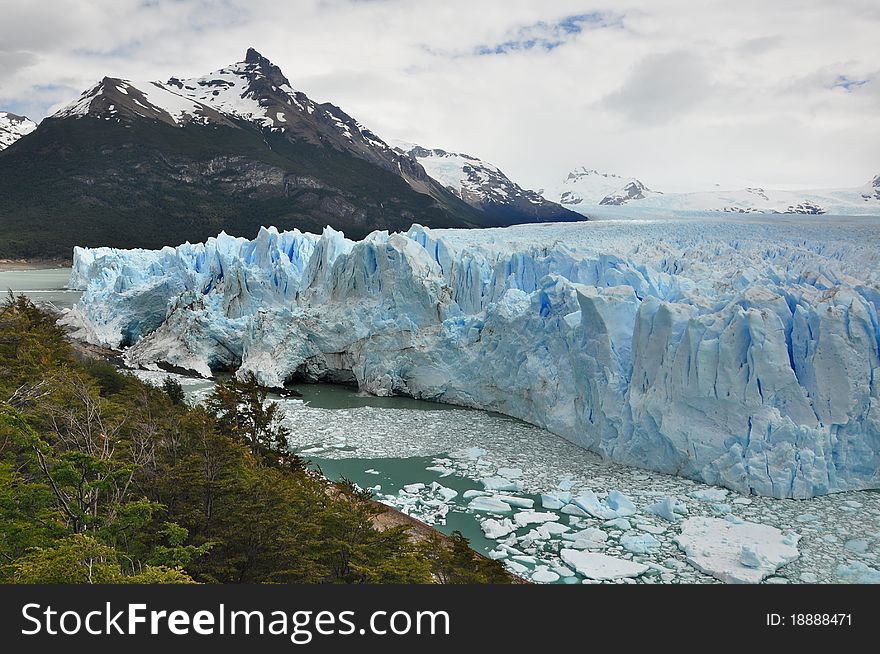 Perito Moreno Glacier, at the Patagonia, in Argentina, with mountains in the background. Perito Moreno Glacier, at the Patagonia, in Argentina, with mountains in the background