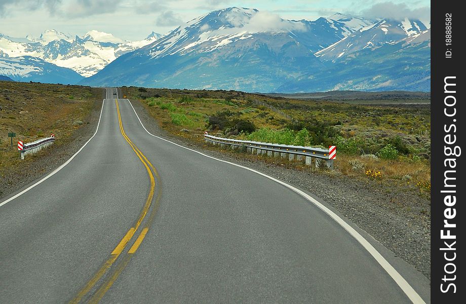 Shot of a road that goes to the mountains, at the Patagonia in Argentina. Shot of a road that goes to the mountains, at the Patagonia in Argentina