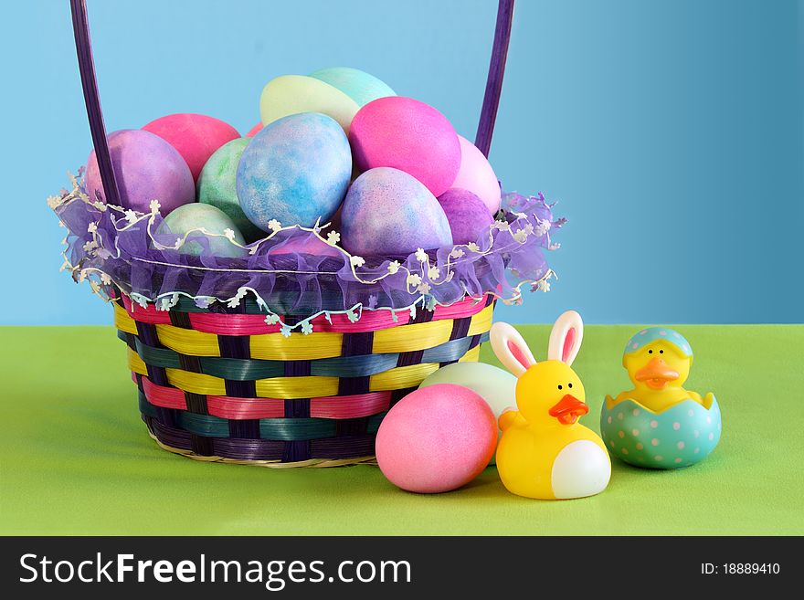 Colorful Easter egg basket with yellow rubber duckies