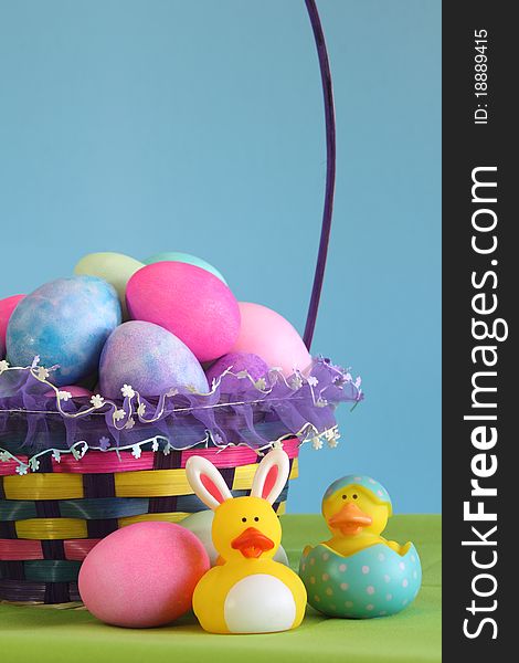 Colorful Easter egg basket with yellow rubber duckies