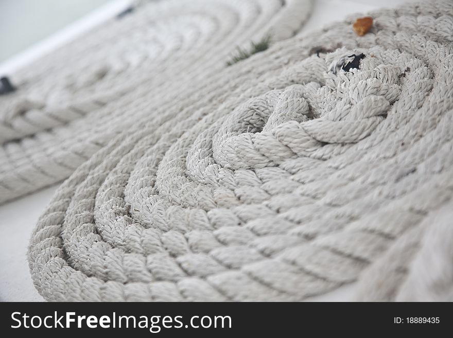 Rolls of rope lies on the deck of the boat. Rolls of rope lies on the deck of the boat