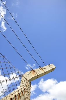Fence With Barbed Wire Under Blue Sky Stock Images Fence With Barbed Wire Under Blue Sky Stock Images