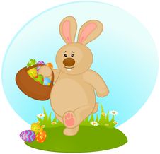 Bunny With Basket And Colored Eggs Stock Images