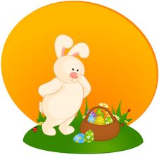 Bunny With Basket And Colored Eggs Stock Photography