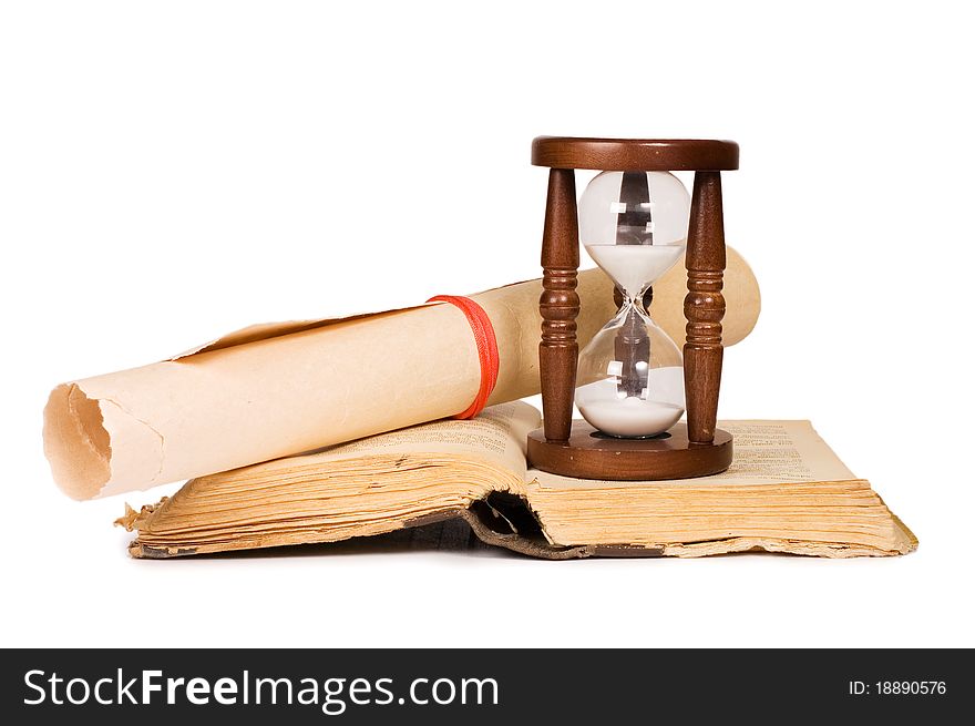 Hourglasses and book on white background