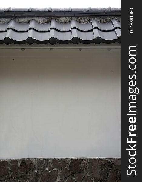 The japanese style black roof tiles and white wall
