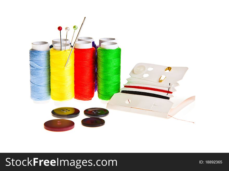 Colorful sewing threads isolated on white