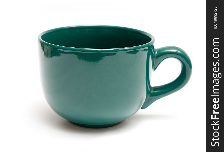 Green mug isolated on a white background