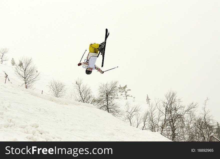 Skier in yellow trousers, flip in the air. Skier in yellow trousers, flip in the air
