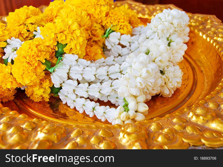 Jasmine garland on gold plate for the worship ceremony