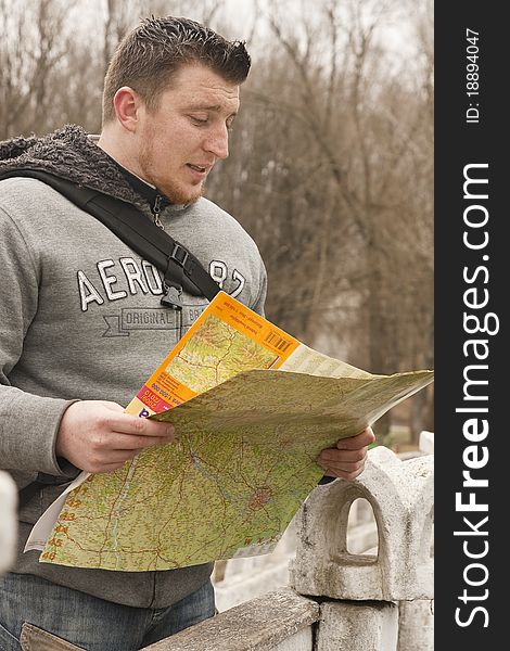 Young boy search destination on the map in moldova