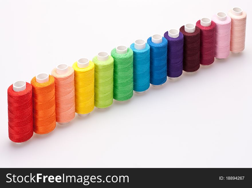 Multi-colored rainbow threads for sewing. Multi-colored rainbow threads for sewing
