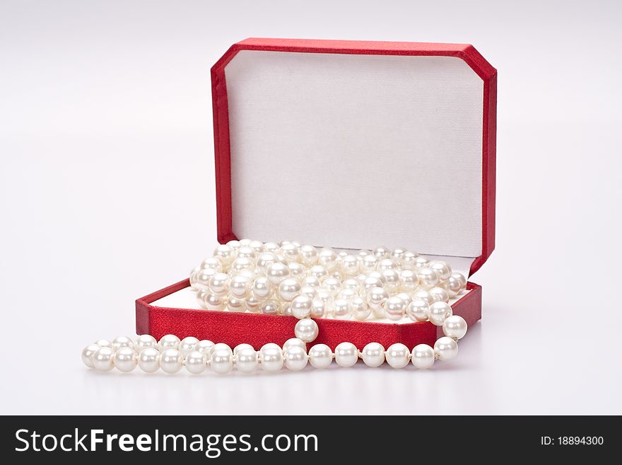 Pearls in a red box