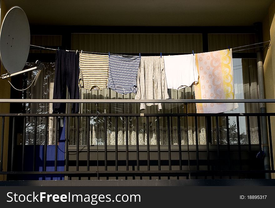 Laundry drying on balcony, sattelite dish. Laundry drying on balcony, sattelite dish