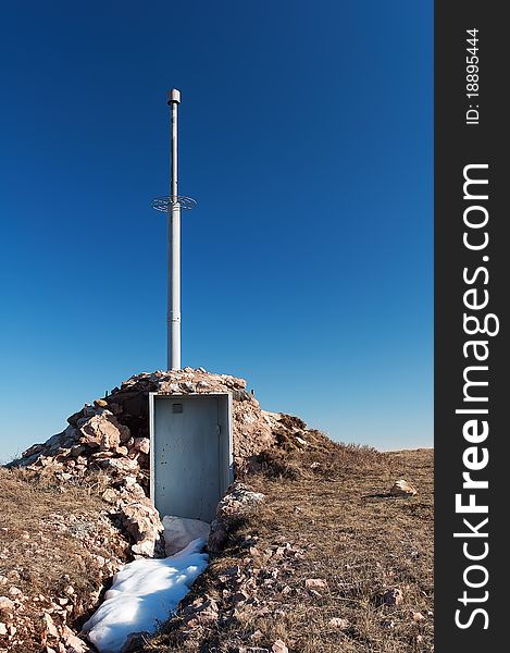 Antenna and a container with equipment on the mountain Chater Dag in Crimea