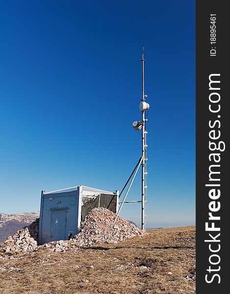 Antenna and a container with equipment on the mountain Chater Dag in Crimea