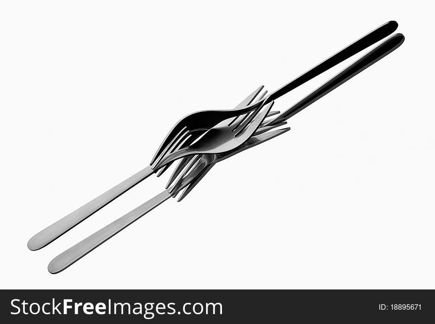 Two forks tangled up on reflecting white background. Two forks tangled up on reflecting white background