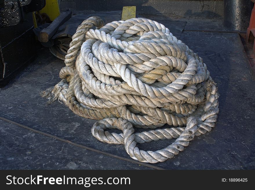 A heavy rope tangled on a ship. A heavy rope tangled on a ship.