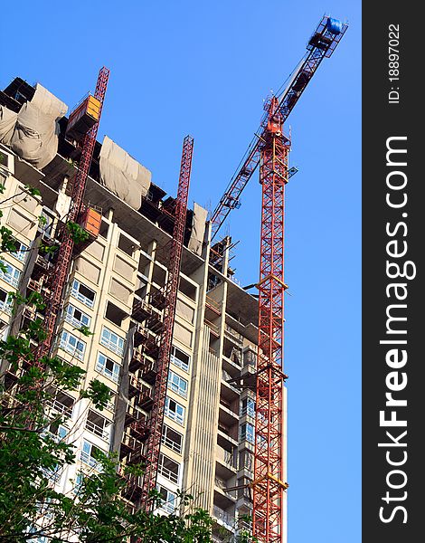 Condominium apartment construction site in bright blue sky in Bangkok urban area
