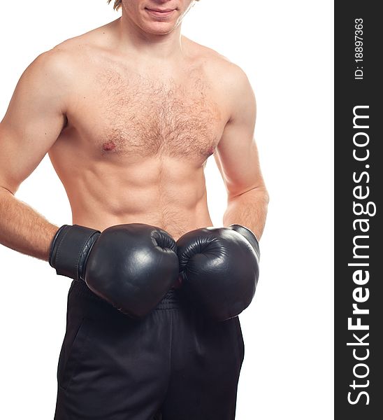 Man boxer with black boxing gloves on white background. Studio shot