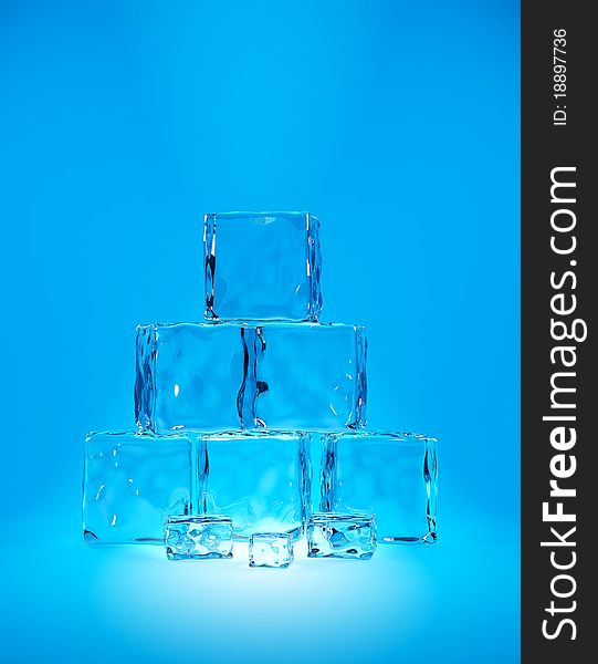 Ice cubes on cyan background