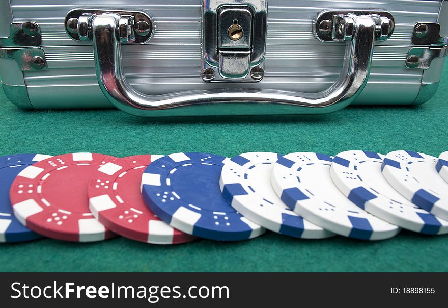 Many poker chips on a green background. Many poker chips on a green background