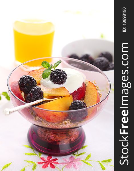 Muesli with fresh berries, fruit and yoghurt