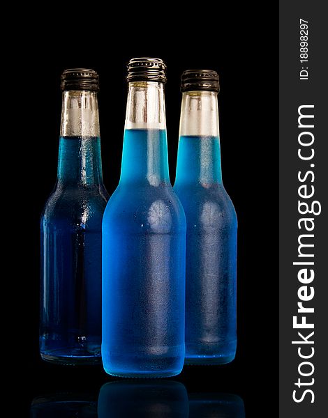 Blue bottles isolated on black background. Blue bottles isolated on black background.