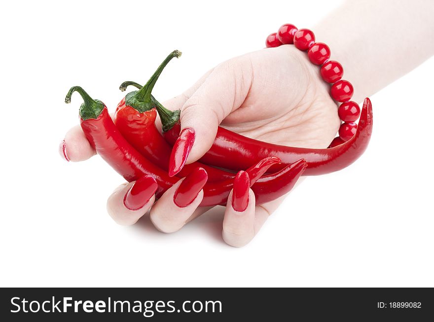 Red pepper in the hands of a girl isolated on a white background