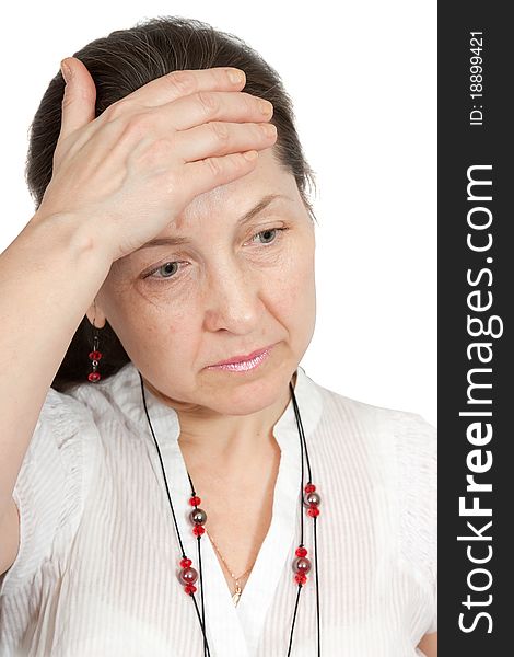 Woman having a headache holding her forehead in pain. Woman having a headache holding her forehead in pain