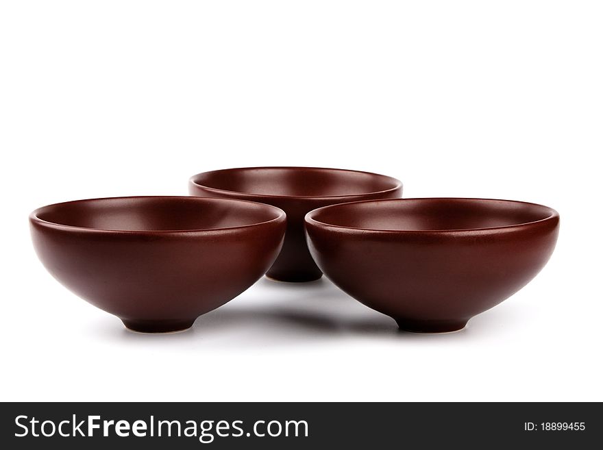 Ceramic brown dishware isolated on white background. Ceramic brown dishware isolated on white background