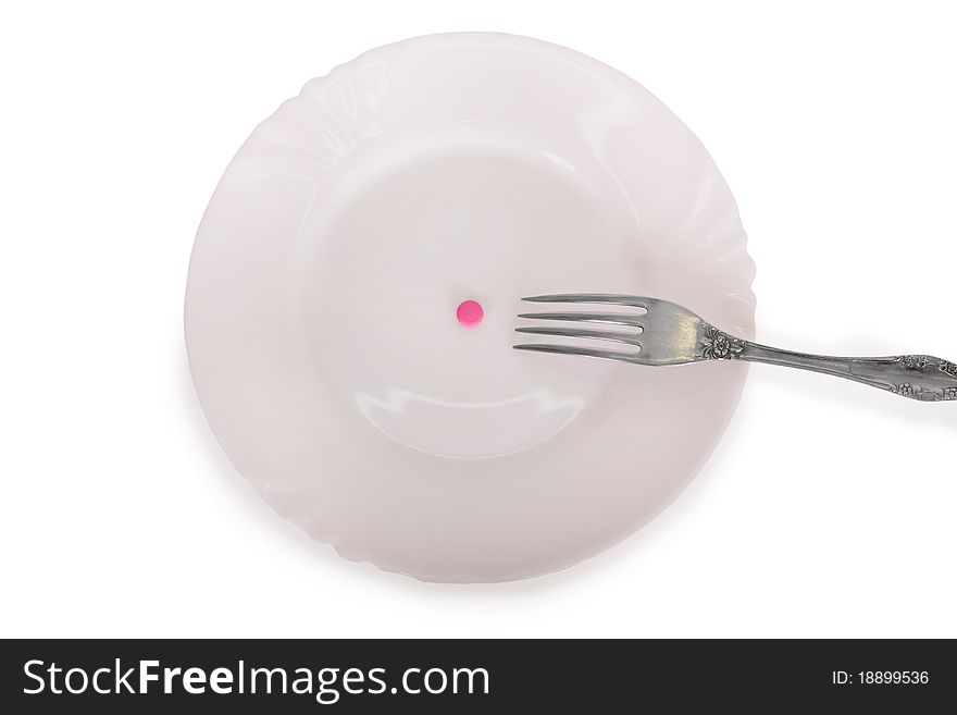 Pink tablets on a white plate isolated on white background. Pink tablets on a white plate isolated on white background