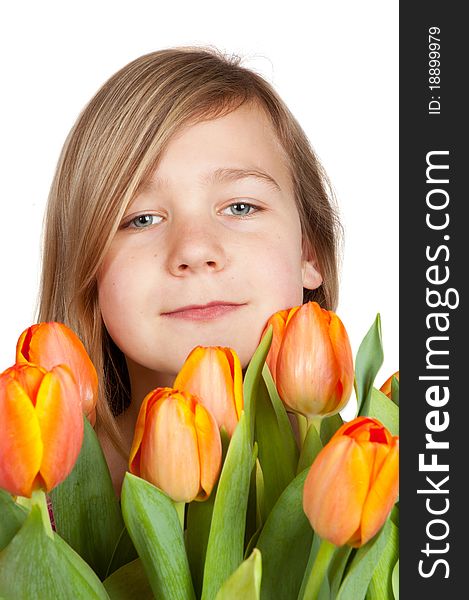 Cute young girl is holding a bunch of tulips