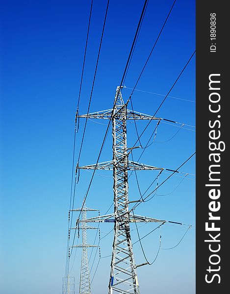 Power line on blue sky.